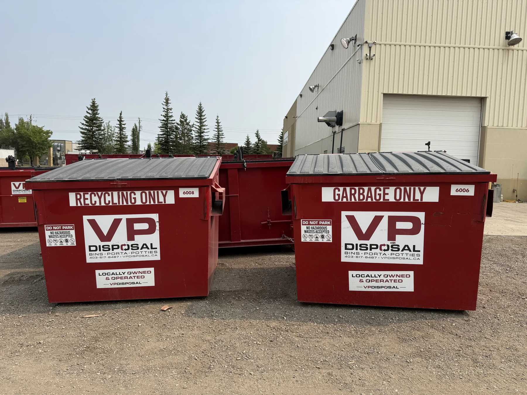 VP Disposal red front-load bins labelled Recycling Only and Garbage Only
